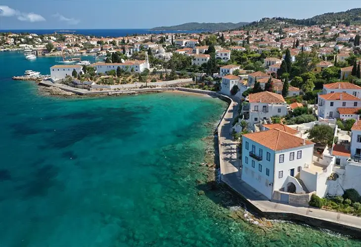 Aerial photo of the seaside town of Spetses with it's neoclassical buildings and turquoise waters